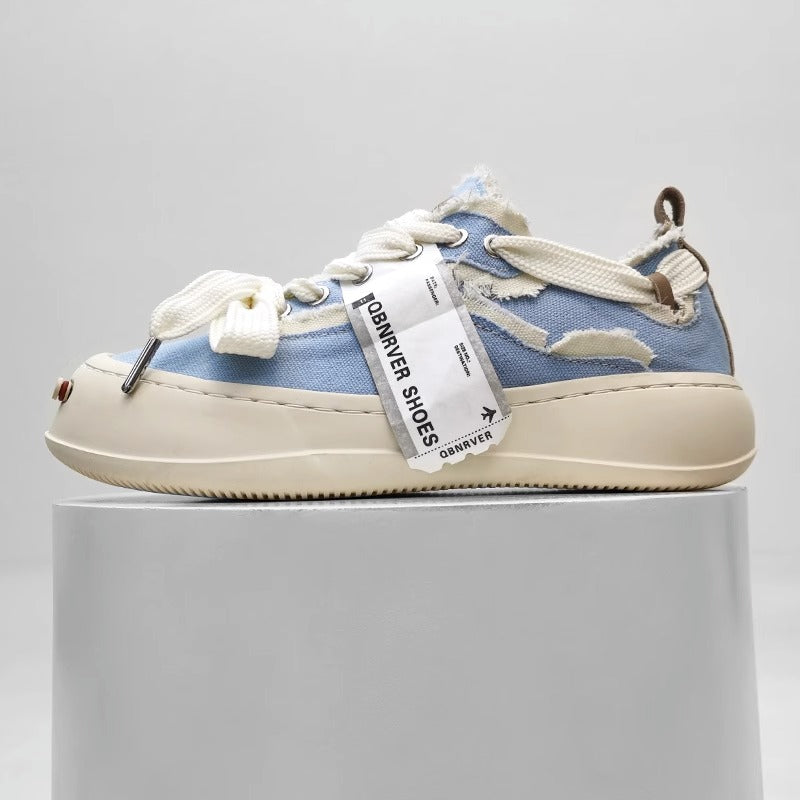 Thick-soled sneakers with raw edges